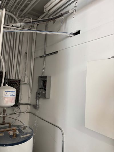 125 amp sub-panel installation with feeder conduit in commercial mechanical room