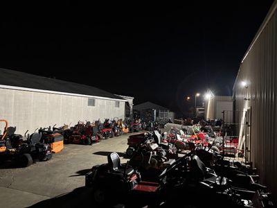 Outdoor commercial equipment yard with new exterior lighting illuminating equipment storage