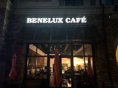 Restored commercial channel-letter sign lighting at café storefront